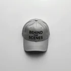 BEHIND THE SCENES Cap